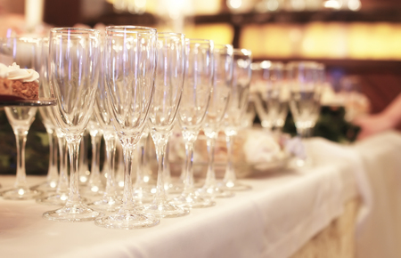 champagne flutes for a toast lined up at the bar