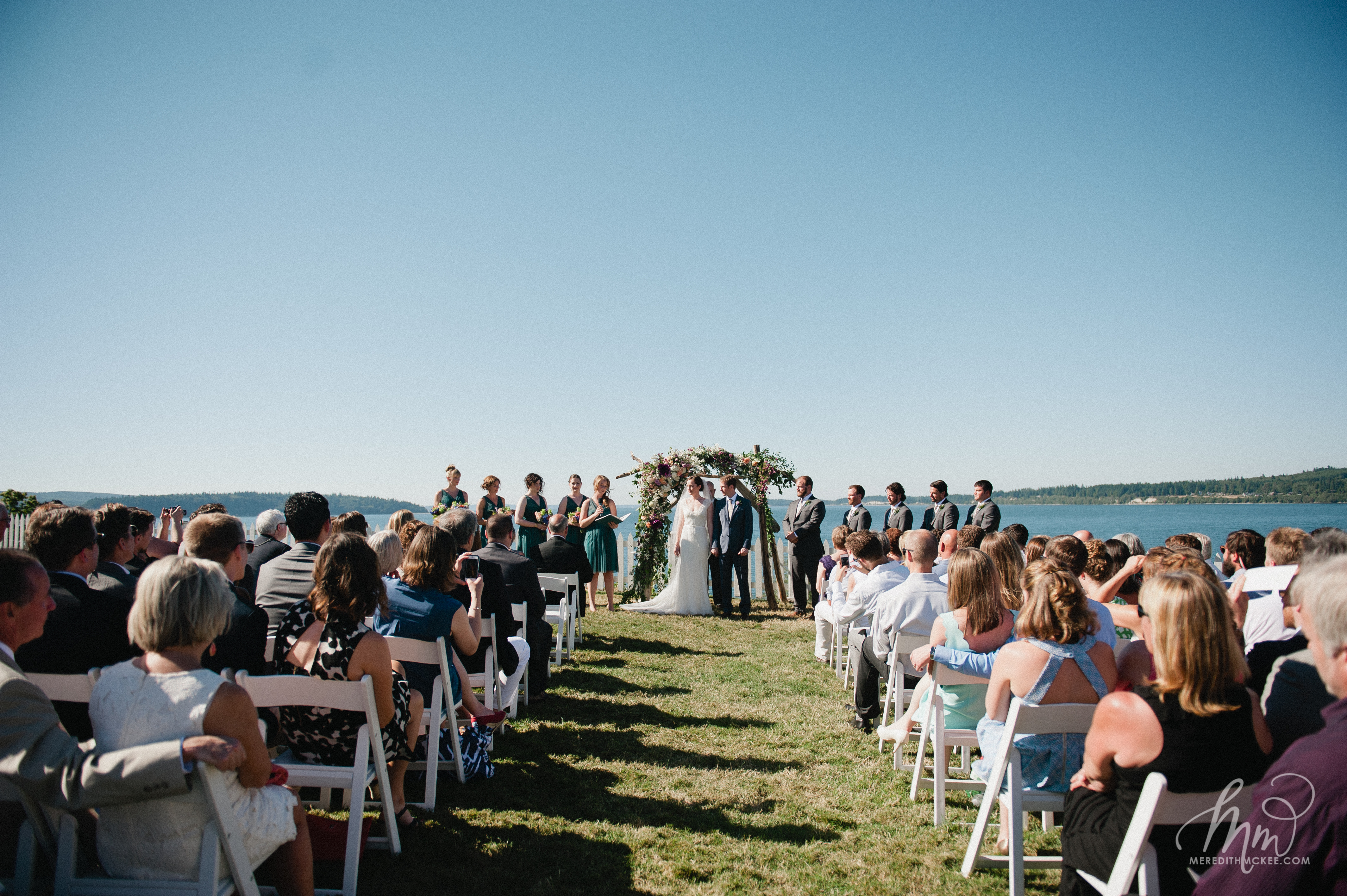 wedding ceremony at the port gamble hood canal vista pavilion, overlooking the bluffs to the puget sound.