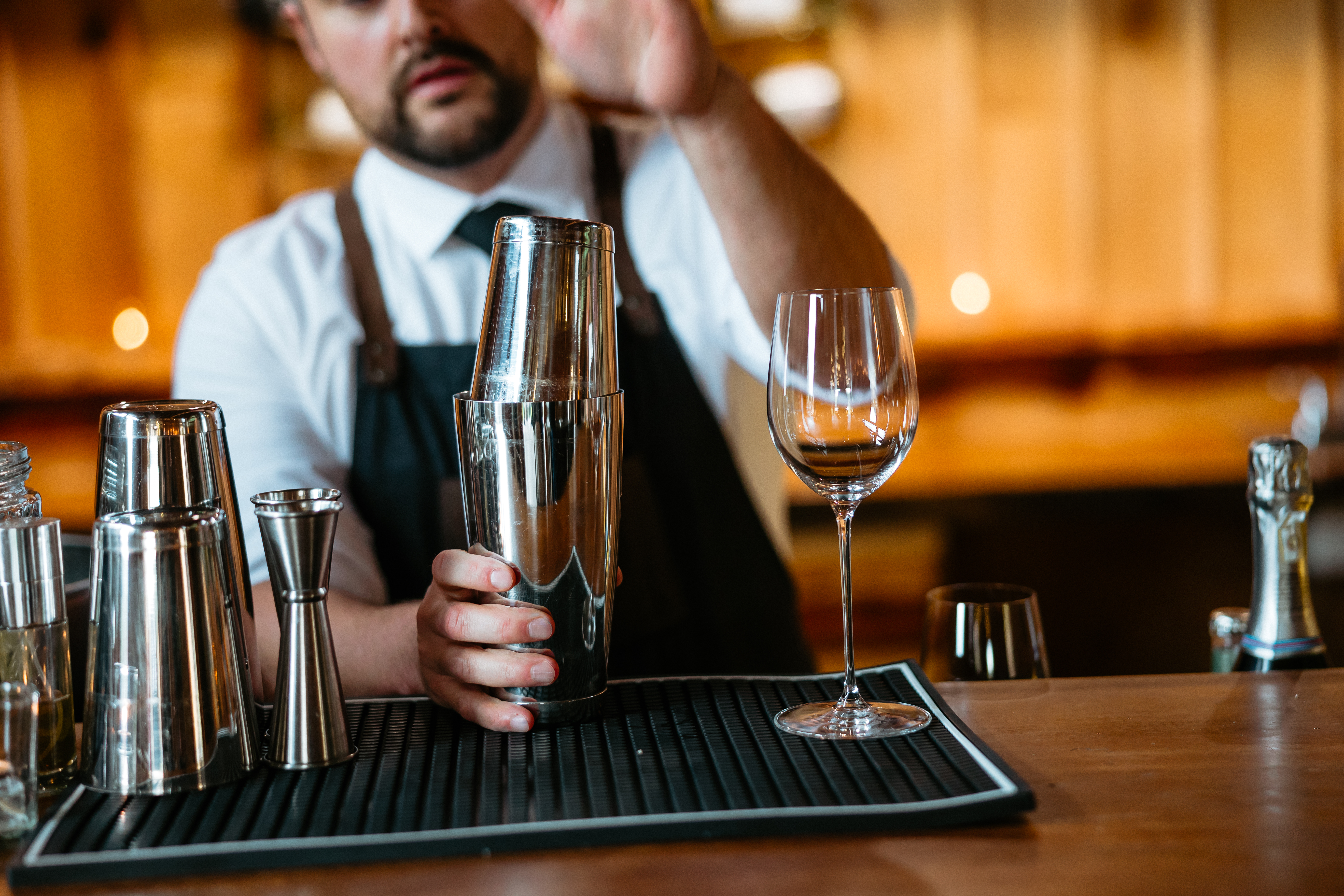 bartender using a double tin shaker