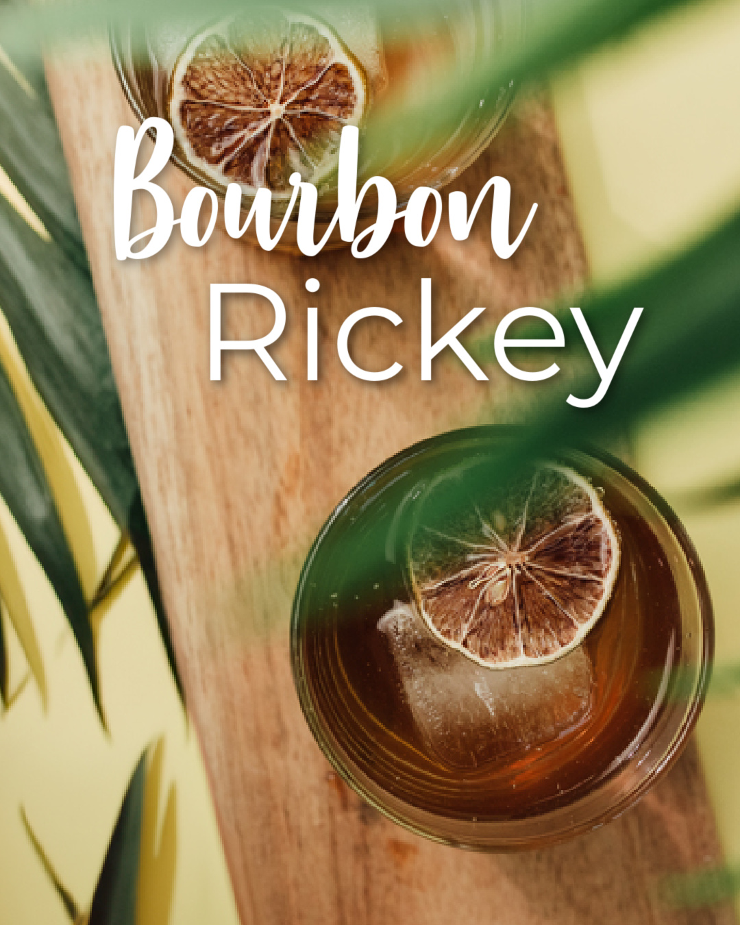 overview of a bourbon cocktail with a dehydrated lime wheel as a garnish for a refreshing cocktail on a summer wedding day.