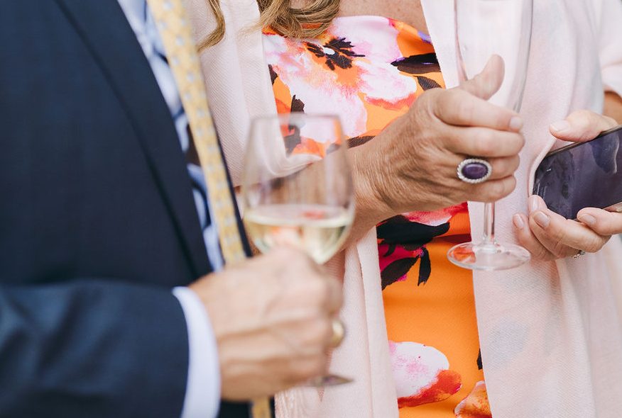 couple holding a glass of wine
