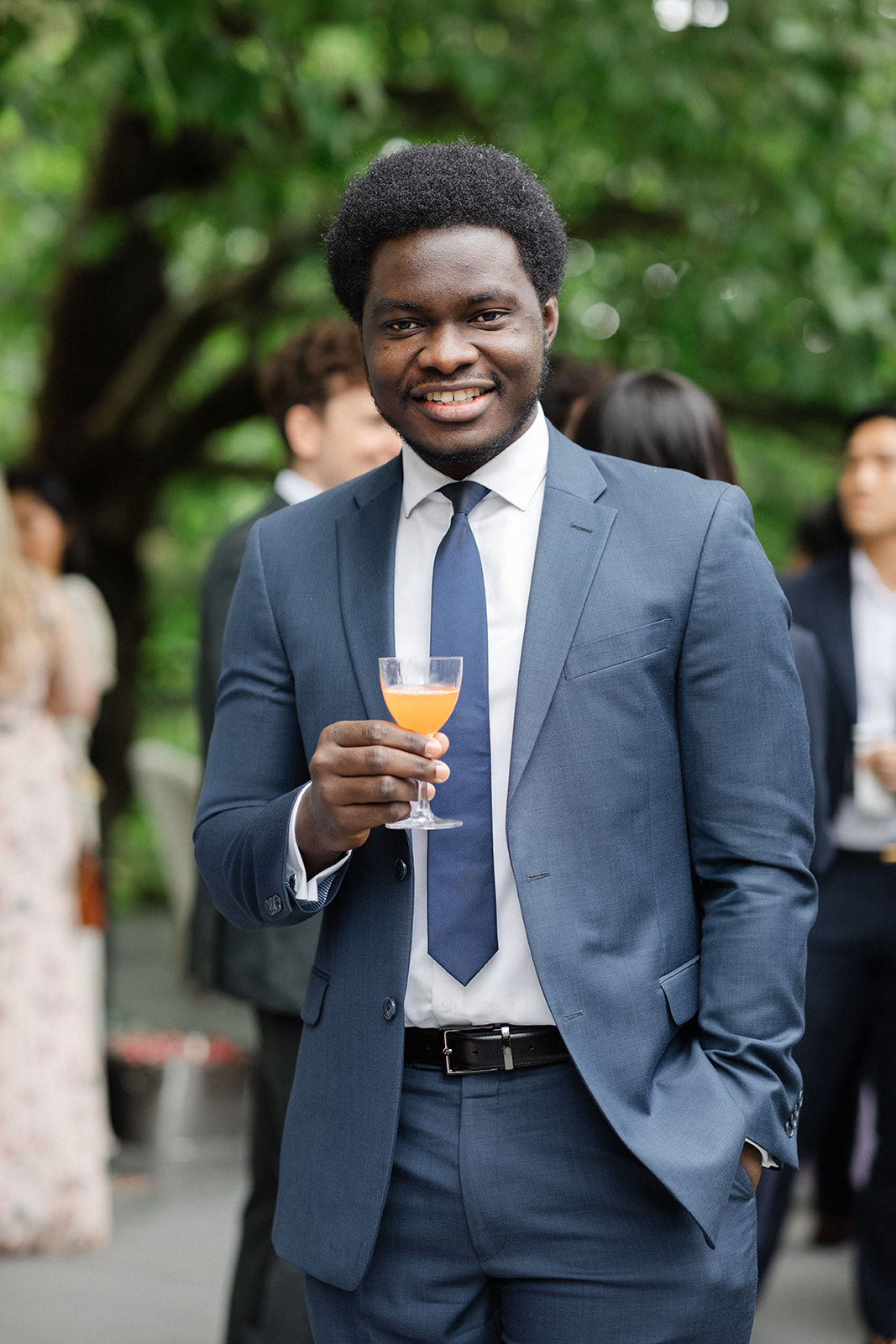 man holding a signature cocktail